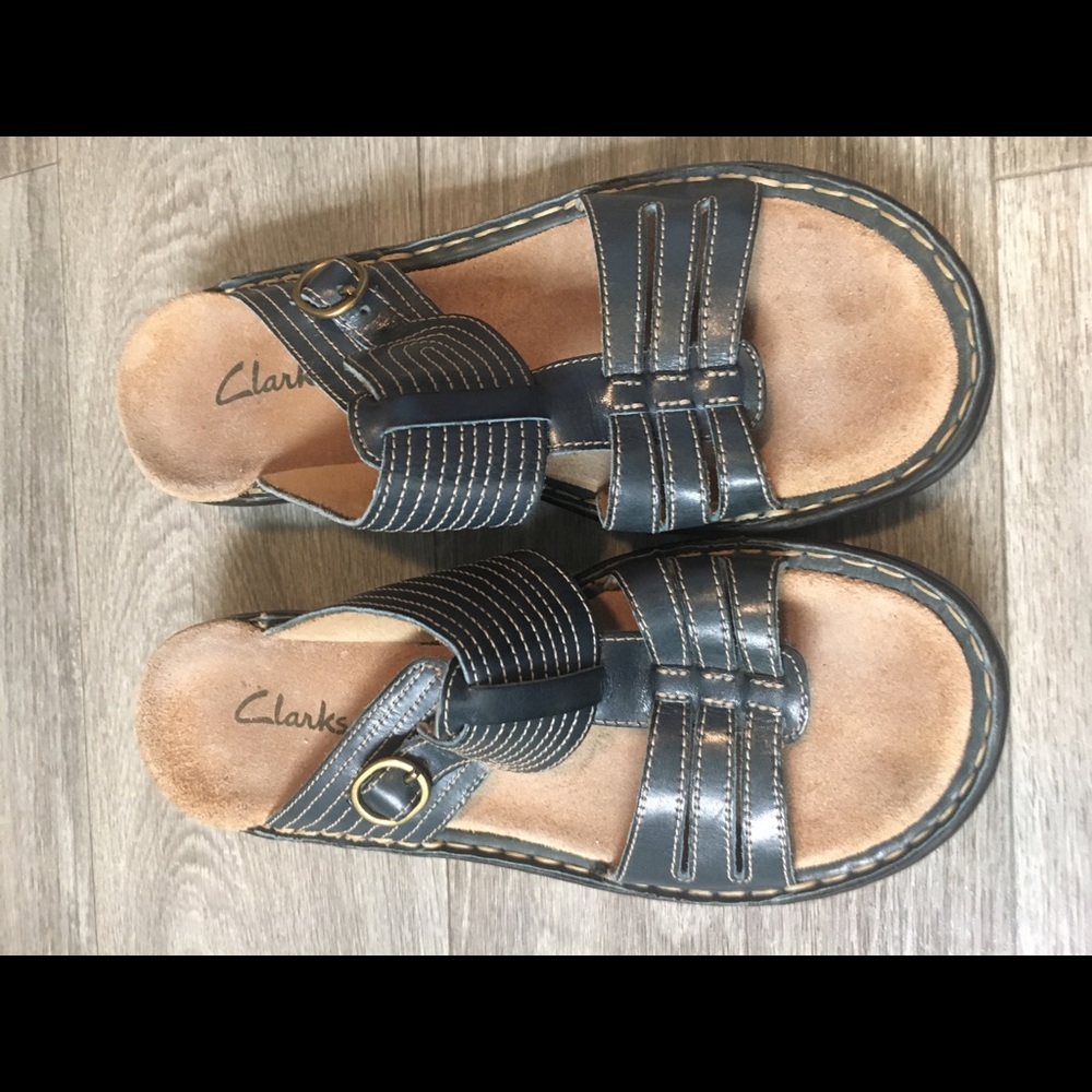 Clark’s blue leather sandals.